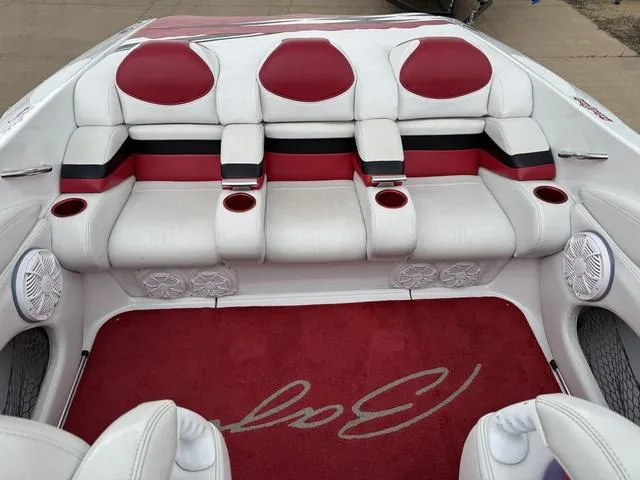 Slide: The Image of 2000 Baja 36 Outlaw boat interior with red and white seating and carpet. - 8
