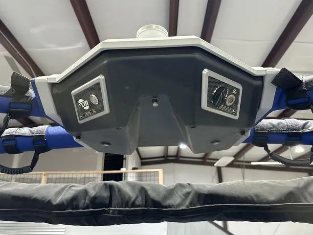 Slide: The Image of Control panel of a 2021 Malibu M220 boat, featuring switches and padded handles. - 16