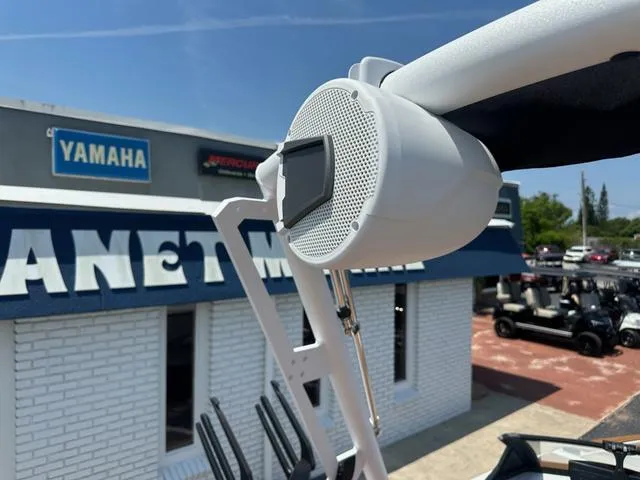 Slide: The Image of Outdoor speaker on Axis Wake Research T Series T220 boat, 2025 model, near Yamaha dealership. - 15