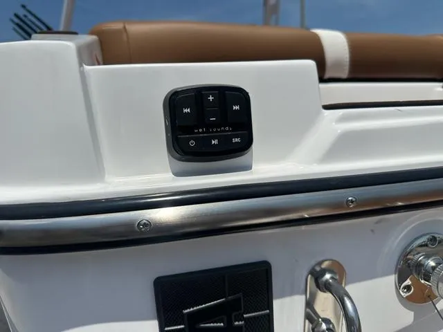 Slide: The Image of 2025 Axis Wake Research T Series T220 boat with audio controls and seating detail. - 16