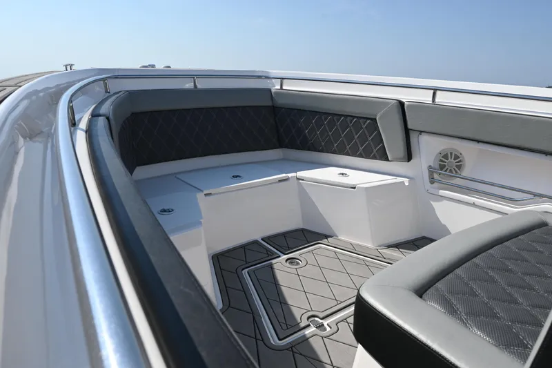 Slide: The Image of 2022 Drakkar 280 CC boat interior with cushioned seating and sleek design. - 17