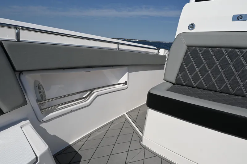 Slide: The Image of 2022 Drakkar 280 CC boat interior with gray seating and sleek design. - 18