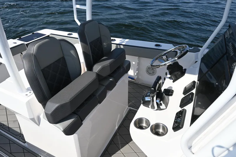 Slide: The Image of 2022 Drakkar 280 CC boat interior with dual seats and modern helm controls. - 24