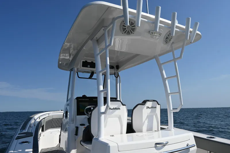 Slide: The Image of 2022 Drakkar 280 CC boat with T-top and dual seats on open water. - 36