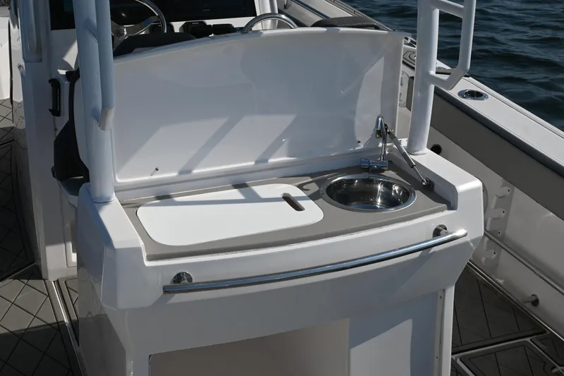 Slide: The Image of 2022 Drakkar 280 CC boat with onboard sink and cutting board. - 38