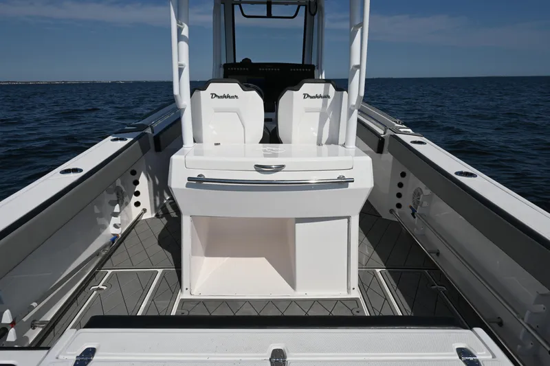 Slide: The Image of 2022 Drakkar 280 CC boat interior on open water, showcasing seating and deck layout. - 40