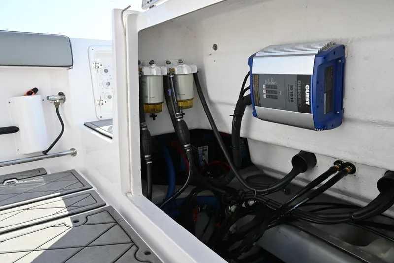 Slide: The Image of Interior view of 2022 Drakkar 280 CC boat showing electrical components and wiring. - 43