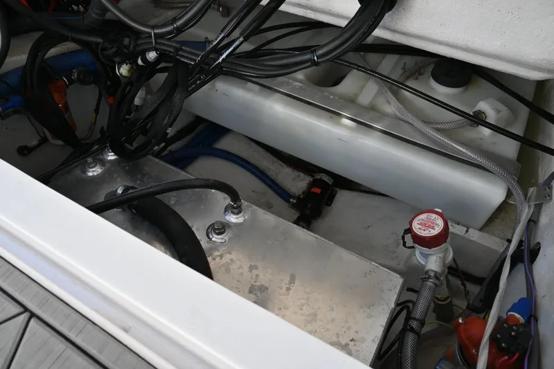 Slide: The Image of Engine compartment of 2022 Drakkar 280 CC boat, showing wiring and components. - 44