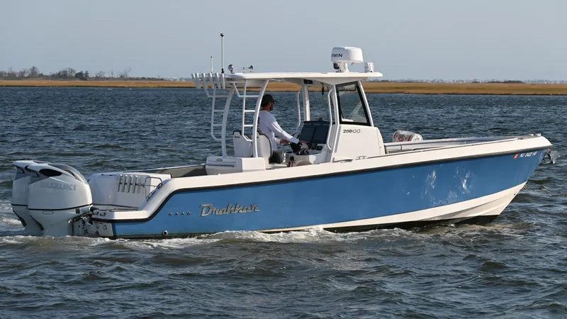 Slide: The Image of 2022 Drakkar 280 CC boat cruising on open water, side view. - 6