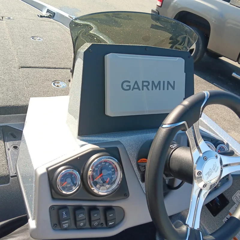 Slide: The Image of 2025 Ranger Z185 boat dashboard with Garmin navigation system and steering wheel. - 14