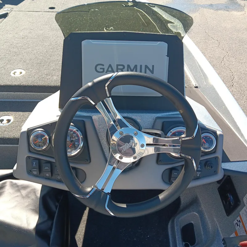 Slide: The Image of Steering wheel and dashboard of 2025 Ranger Z185 boat with Garmin display. - 15