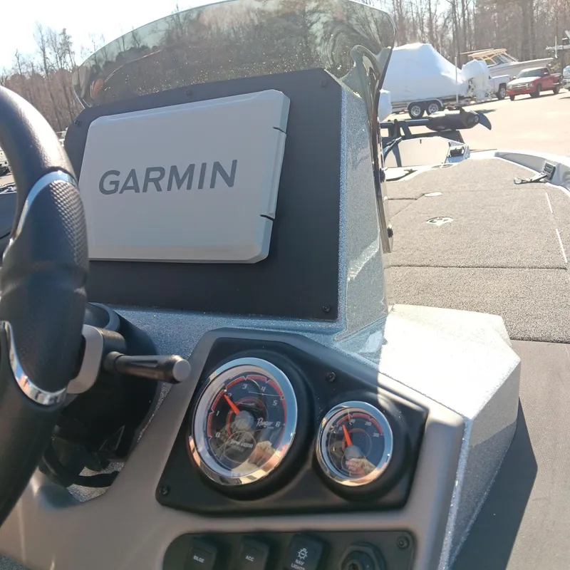 Slide: The Image of 2025 Ranger Z185 boat dashboard with Garmin navigation system and gauges. - 16