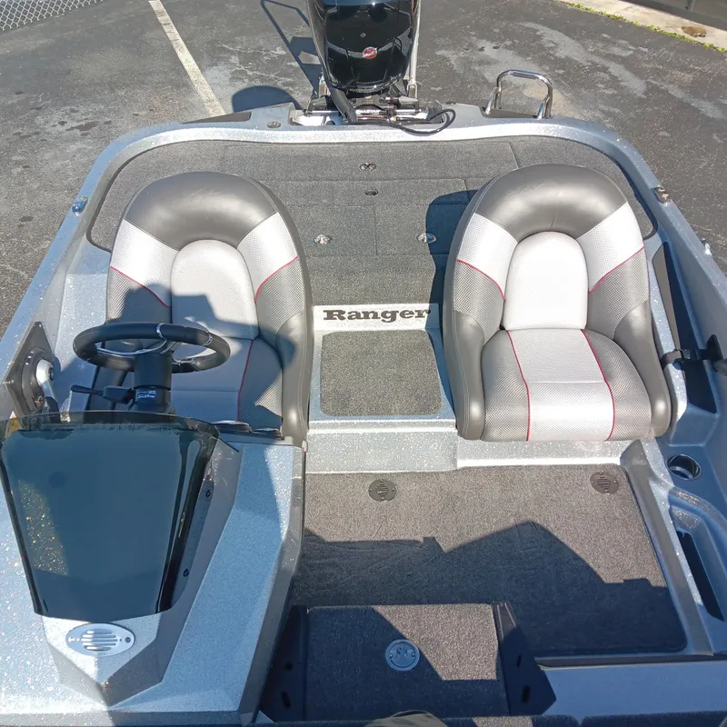 Slide: The Image of 2025 Ranger Z185 boat interior with dual seats and steering console. - 17