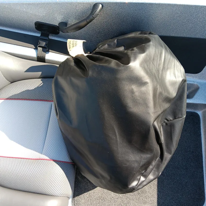 Slide: The Image of Black bag on seat of 2025 Ranger Z185 boat interior. - 20