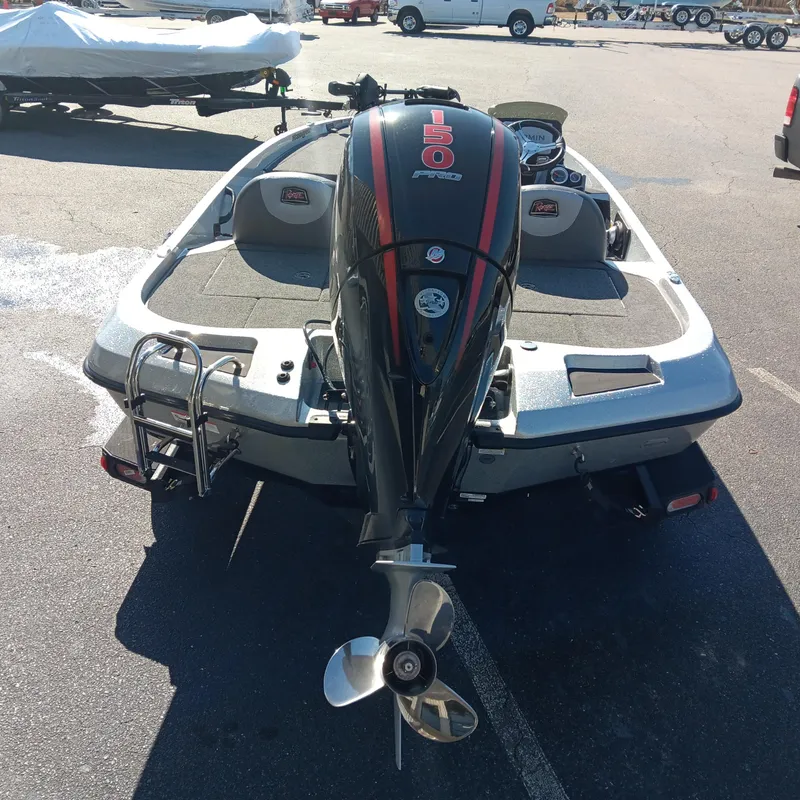Slide: The Image of 2025 Ranger Z185 boat with powerful outboard motor in a parking lot. - 5