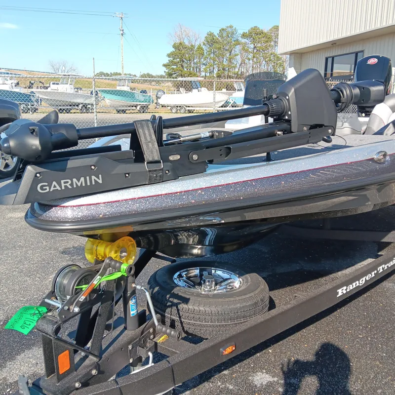 Slide: The Image of 2025 Ranger Z185 boat with Garmin equipment on trailer in outdoor setting. - 7