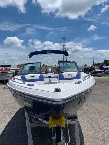 Slide: The Image of 2017 Monterey 197 Outboard boat on trailer under blue sky. - 4