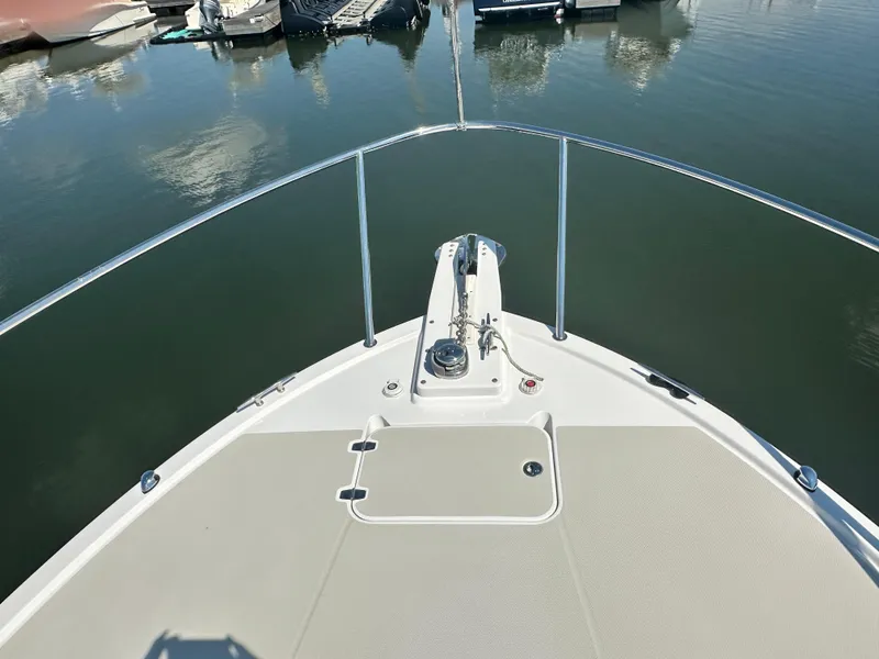 Slide: The Image of Bow view of 2013 Back Cove 34 boat docked in a marina. - 17