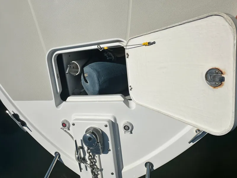 Slide: The Image of 2013 Back Cove 34 boat anchor locker with open hatch and visible chain. - 21