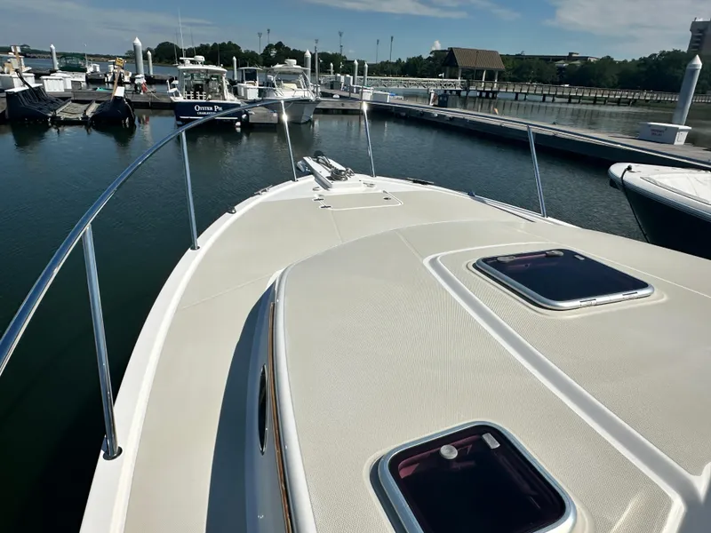 Slide: The Image of 2013 Back Cove 34 boat docked at marina, view from bow. - 25