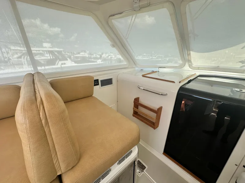 Slide: The Image of Interior of 2013 Back Cove 34 boat with beige seating and modern amenities. - 42