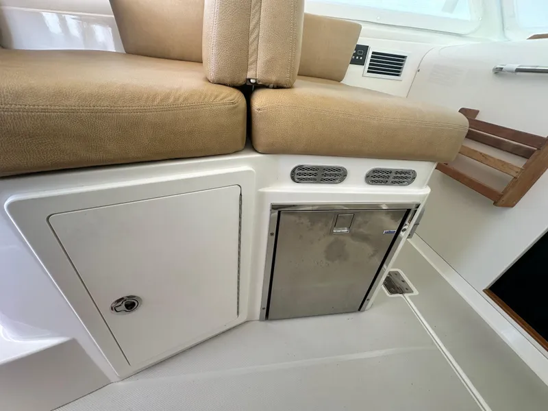 Slide: The Image of Interior seating and storage area on a 2013 Back Cove 34 boat. - 43