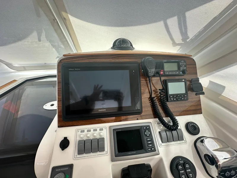 Slide: The Image of Control panel of a 2013 Back Cove 34 boat with navigation equipment. - 46