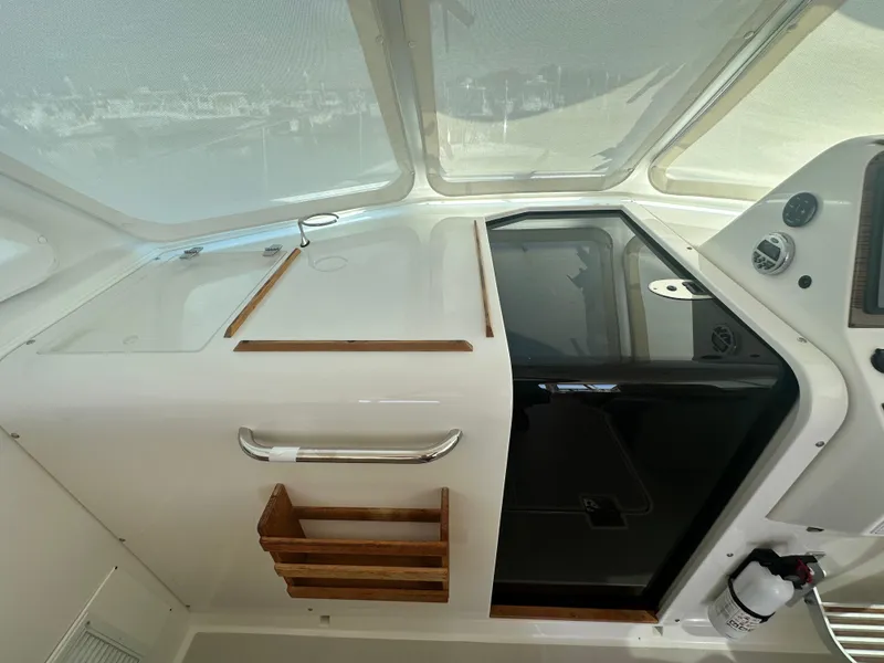 Slide: The Image of 2013 Back Cove 34 boat interior with sleek design and modern controls. - 47