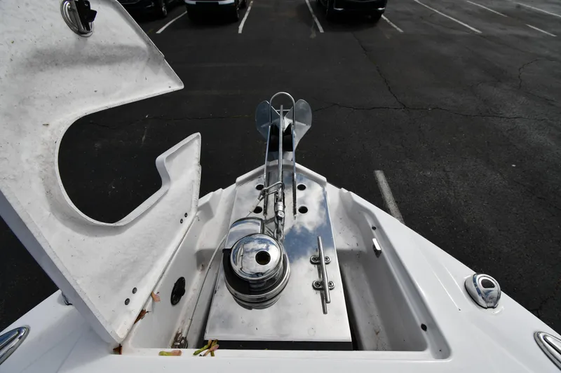 Slide: The Image of 2023 Monterey 278 Super Sport boat anchor compartment with open hatch in parking lot. - 12