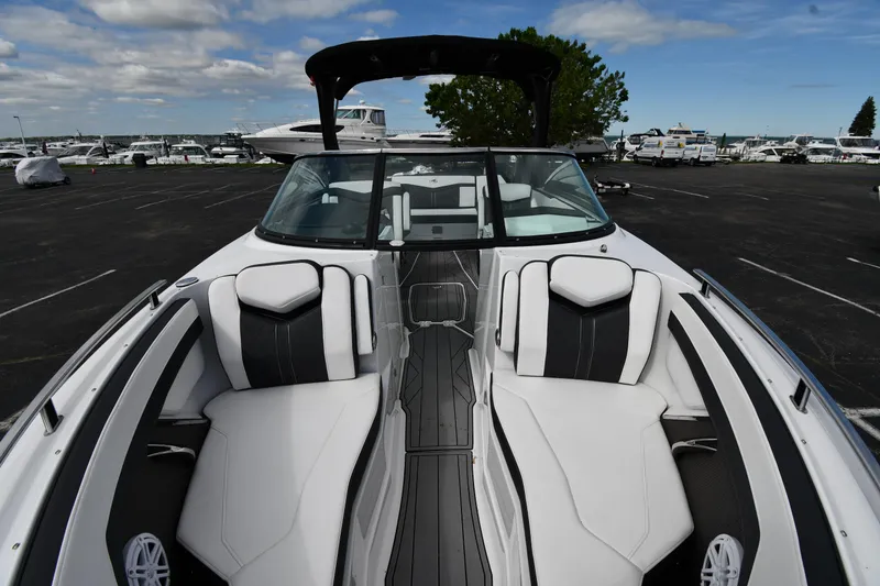 Slide: The Image of 2023 Monterey 278 Super Sport boat with sleek white and black interior design. - 13