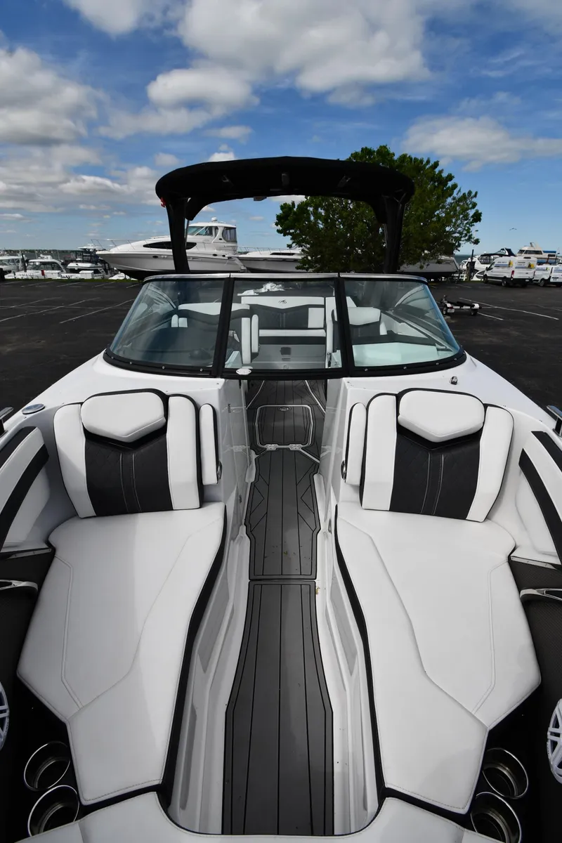 Slide: The Image of 2023 Monterey 278 Super Sport boat with sleek white and black interior design. - 14