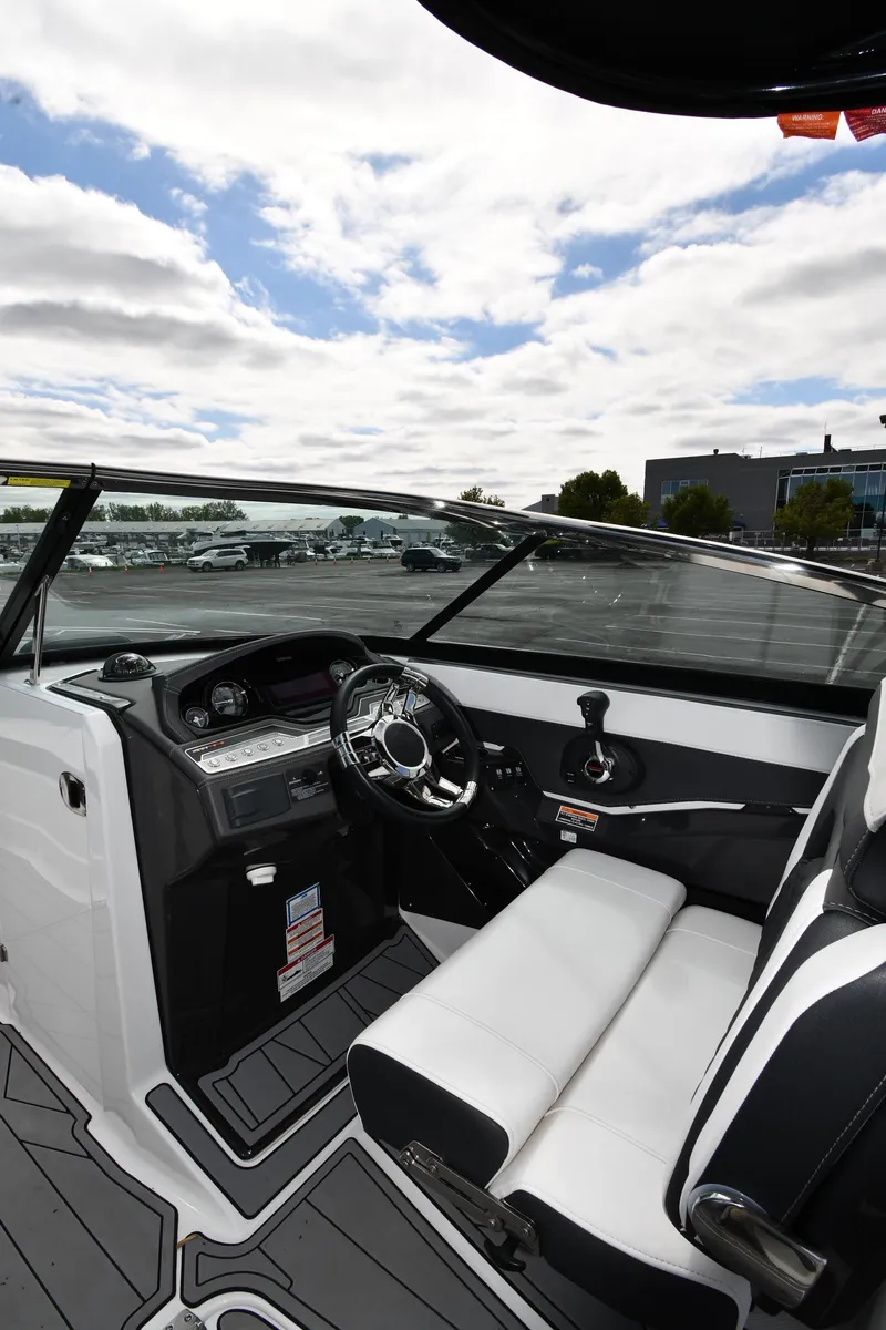 Slide: The Image of 2023 Monterey 278 Super Sport boat interior with sleek dashboard and seating. - 17