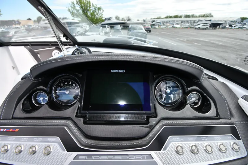 Slide: The Image of 2023 Monterey 278 Super Sport dashboard with Simrad display and gauges. - 18