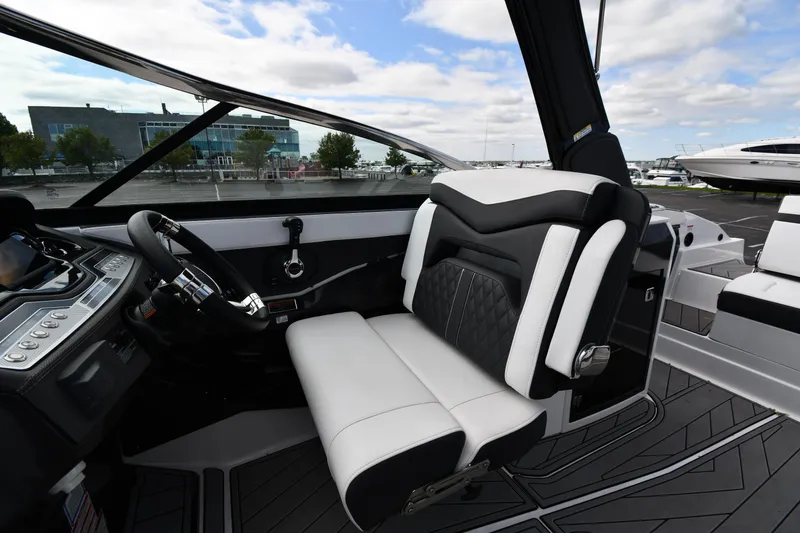 Slide: The Image of 2023 Monterey 278 Super Sport boat interior with sleek black and white seating. - 21
