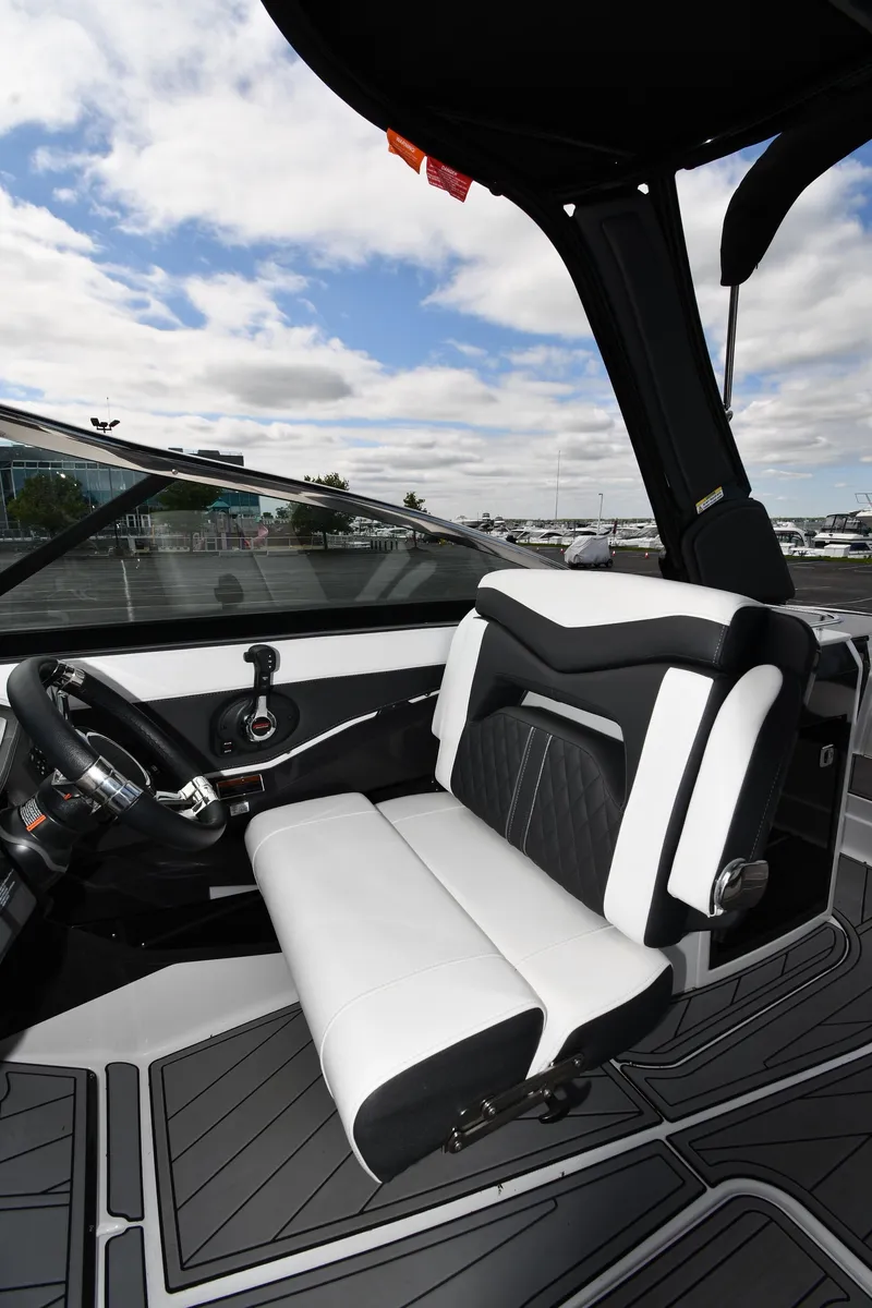 Slide: The Image of 2023 Monterey 278 Super Sport boat interior with sleek black and white seating. - 22