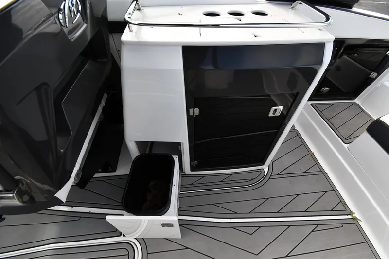 Slide: The Image of 2023 Monterey 278 Super Sport boat interior with sleek cabinetry and modern flooring design. - 33