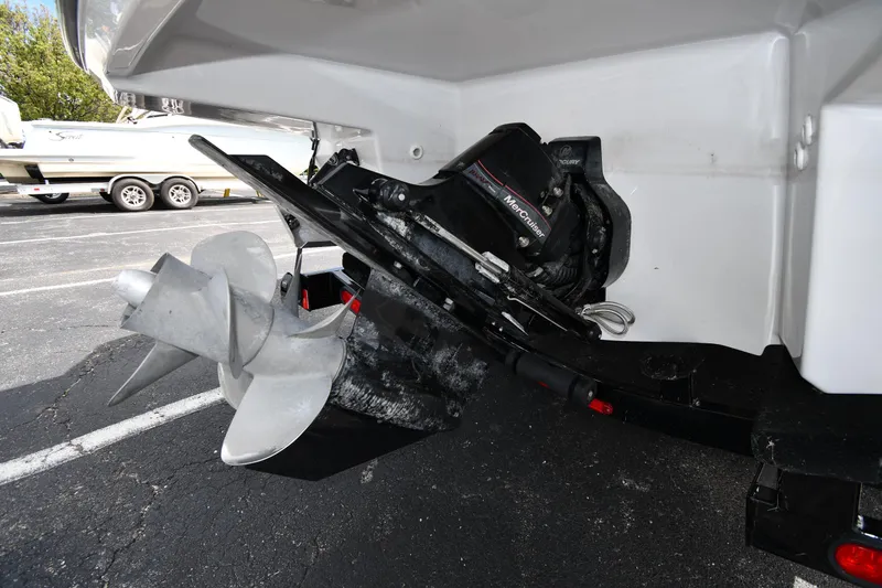 Slide: The Image of 2023 Monterey 278 Super Sport boat propeller and engine detail in a parking lot. - 4