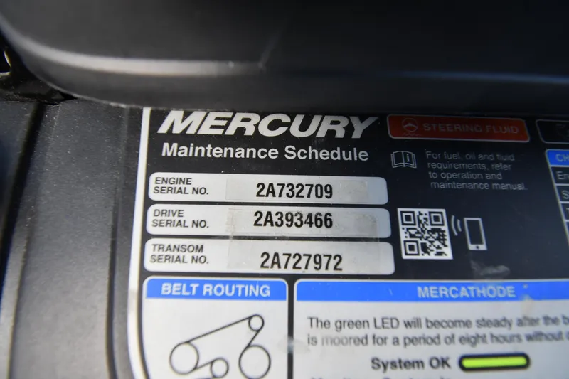 Slide: The Image of Mercury maintenance schedule label with serial numbers for engine, drive, and transom on a 2023 Monterey 278 Super Sport. - 48