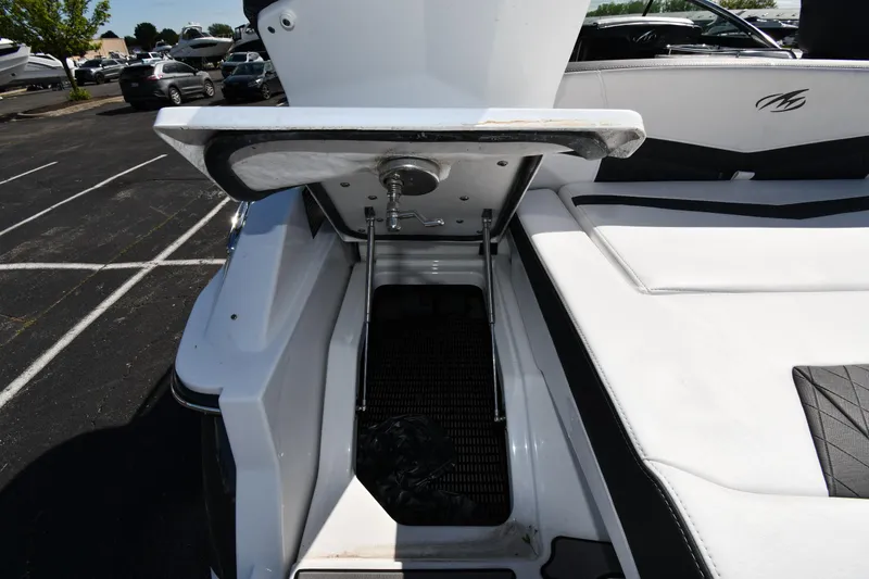 Slide: The Image of 2023 Monterey 278 Super Sport boat with open storage compartment on deck. - 49