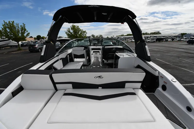 Slide: The Image of 2023 Monterey 278 Super Sport boat with sleek interior design, parked outdoors. - 9