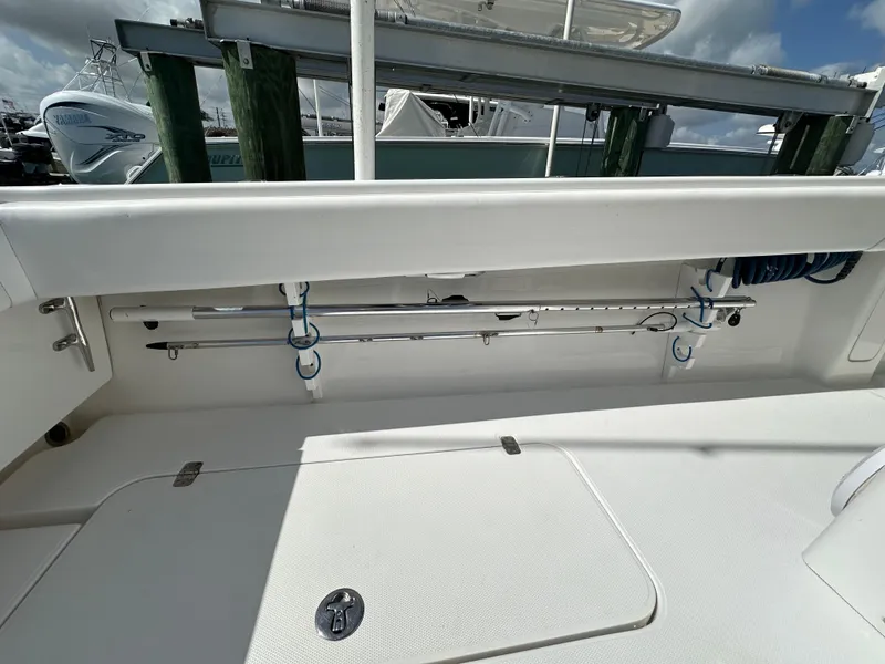 Slide: The Image of 2006 Island Runner 35 boat interior with fishing rod storage. - 21