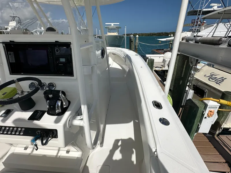 Slide: The Image of 2006 Island Runner 35 boat interior with steering console, docked at marina. - 31
