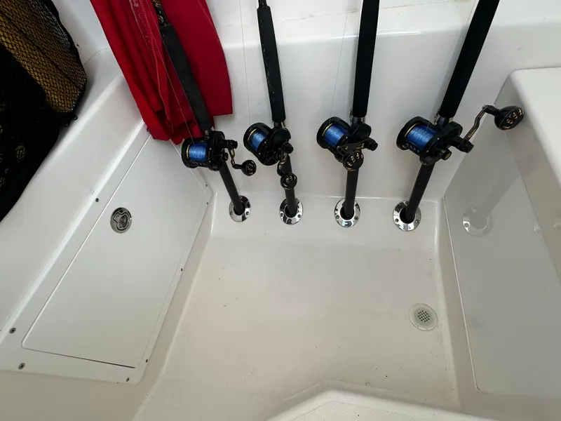 Slide: The Image of Fishing rods in holders on a 2006 Island Runner 35 boat deck. - 36