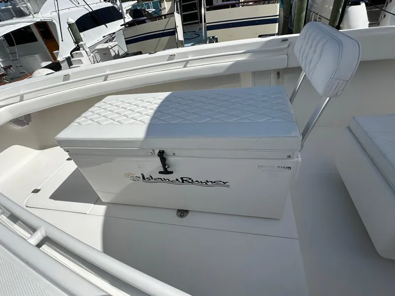 Slide: The Image of 2006 Island Runner 35 boat with cushioned seating and storage compartment. - 45