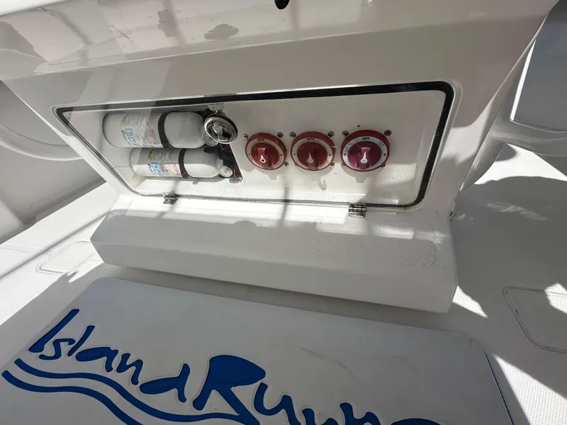 Slide: The Image of Control panel on 2006 Island Runner 35 boat with logo and gauges. - 9