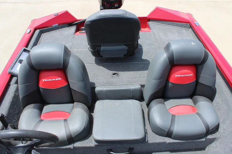 Slide: The Image of 2025 Tracker Pro Team 175 boat interior with gray and red seating. - 10