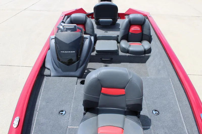Slide: The Image of 2025 Tracker Pro Team 175 boat interior with red and black seating. - 13