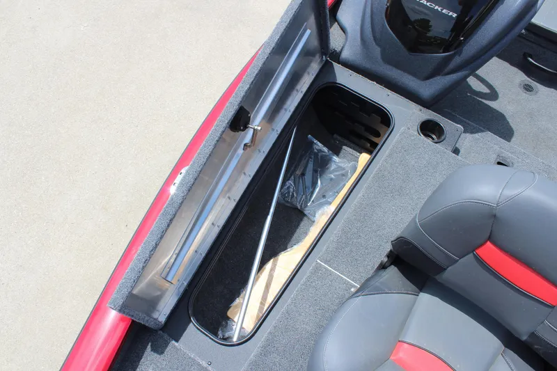 Slide: The Image of 2025 Tracker Pro Team 175 boat interior with open storage compartment and seating. - 14