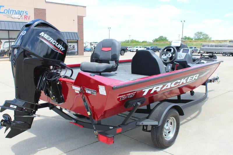 Slide: The Image of 2025 Tracker Pro Team 175 boat with Mercury engine, parked outdoors. - 7