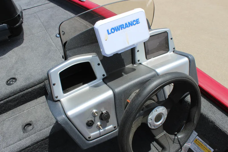 Slide: The Image of 2025 Tracker Pro Team 175 boat dashboard with Lowrance electronics and steering wheel. - 9